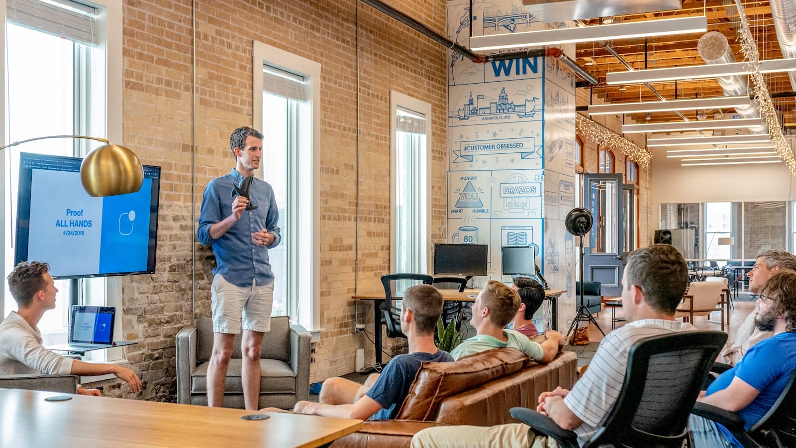 Engineering team in a modern office discussing a software architecture initiative